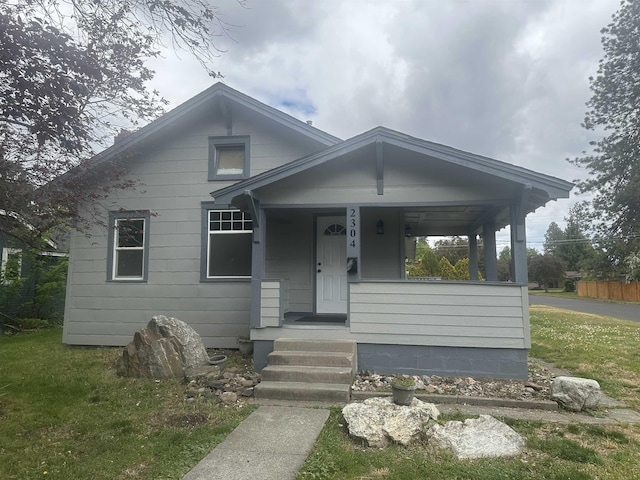 2304 W Glass St, Spokane, WA 99205 - bungalow-style house with covered porch and a front yard