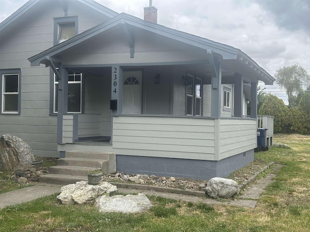 2304 W Glass St, Spokane, WA 99205 - view of front of home featuring a chimney and a porch