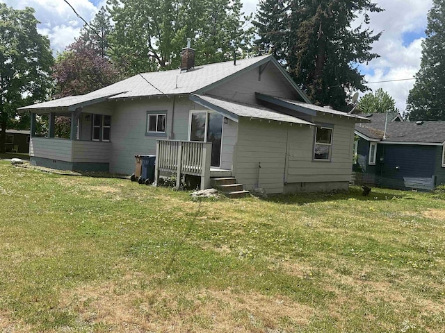 2304 W Glass St, Spokane, WA 99205 - rear view of house featuring a chimney, a lawn, a deck, and crawl space