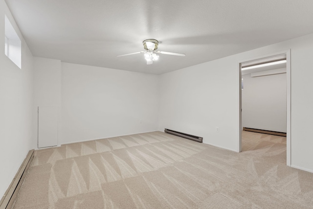 2612 E Longfellow Ave, Spokane, WA 99207 - carpeted empty room featuring baseboard heating, a baseboard heating unit, ceiling fan, and baseboards