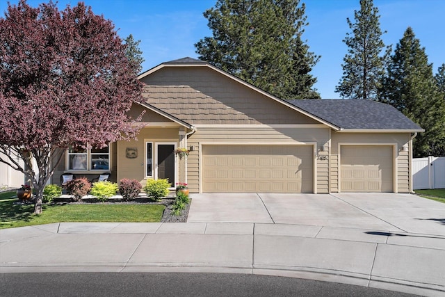 7405 E 13th Ct, Spokane, WA 99212 - view of front of home with a garage and concrete driveway