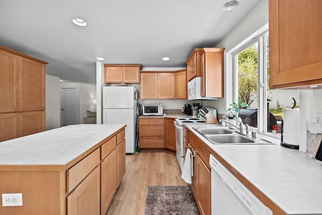 1626 5th St, Cheney, WA 99004 - kitchen with white appliances, a sink, light wood-style flooring, light countertops, and recessed lighting