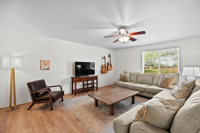 1626 5th St, Cheney, WA 99004 - living room featuring a ceiling fan, light wood-style floors, and baseboards