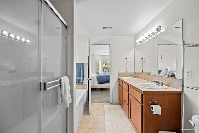 1626 5th St, Cheney, WA 99004 - bathroom with ensuite bath, double vanity, and a shower stall
