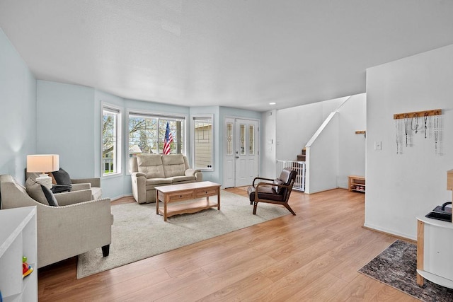 1626 5th St, Cheney, WA 99004 - living room featuring light wood-style flooring and stairs