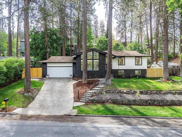 view of front of house featuring driveway, a garage, brick siding, and stairs