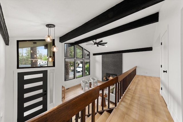 hallway with light wood finished floors and baseboards