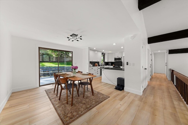 dining area with light wood finished floors, baseboards, and recessed lighting