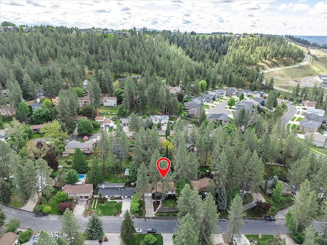 aerial view of property's location with nearby suburban area