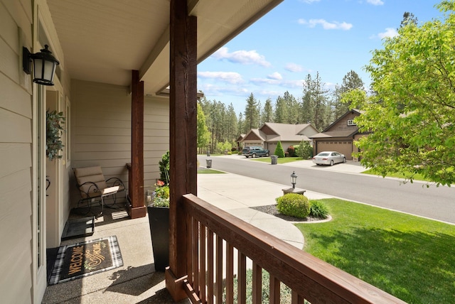 balcony featuring a porch and a residential view