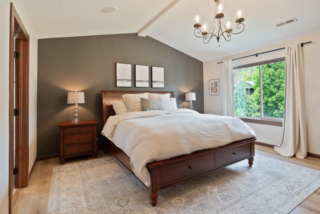 bedroom featuring light wood-style flooring, a chandelier, and baseboards