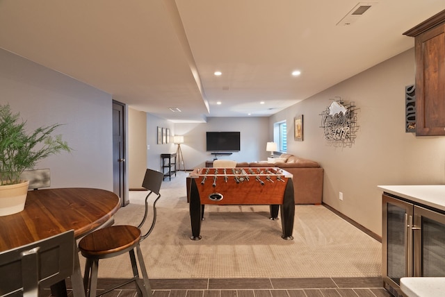 rec room with carpet, beverage cooler, recessed lighting, and baseboards
