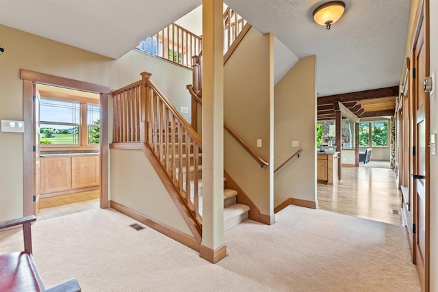 4224 E Hoffman Ln, Spokane, WA 99223 - staircase with carpet floors, plenty of natural light, and baseboards