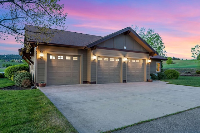 4224 E Hoffman Ln, Spokane, WA 99223 - garage at dusk with driveway and a yard
