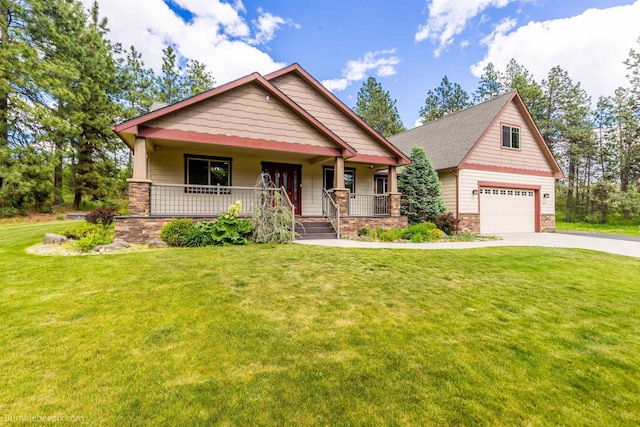 craftsman-style house with a porch, driveway, stone siding, and a front yard
