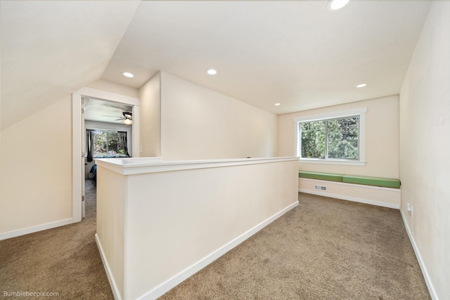 additional living space featuring carpet flooring, recessed lighting, baseboards, and lofted ceiling