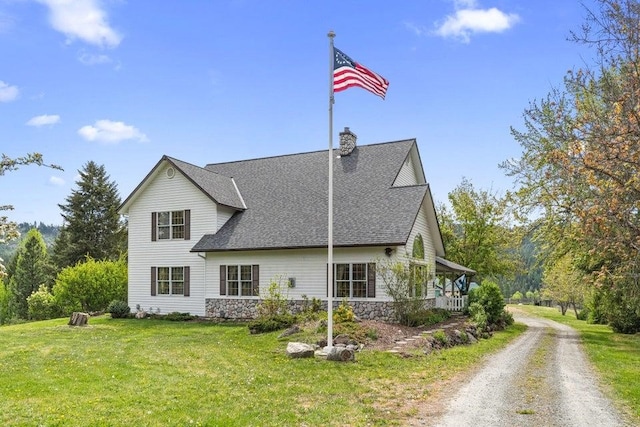 2059 Dry Creek Rd, Chewelah, WA 99109 - back of property with a yard, a shingled roof, a chimney, and stone siding