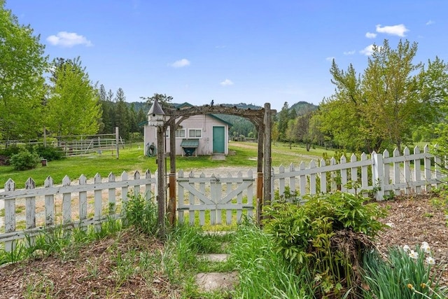 2059 Dry Creek Rd, Chewelah, WA 99109 - gate featuring a shed and an outbuilding
