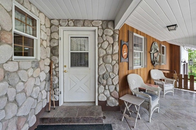 2059 Dry Creek Rd, Chewelah, WA 99109 - view of exterior entry with stone siding and a porch