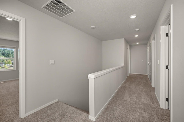 3285 N Mckinnon Rd, Spokane, WA 99217 - hall featuring carpet flooring, an upstairs landing, recessed lighting, and baseboards