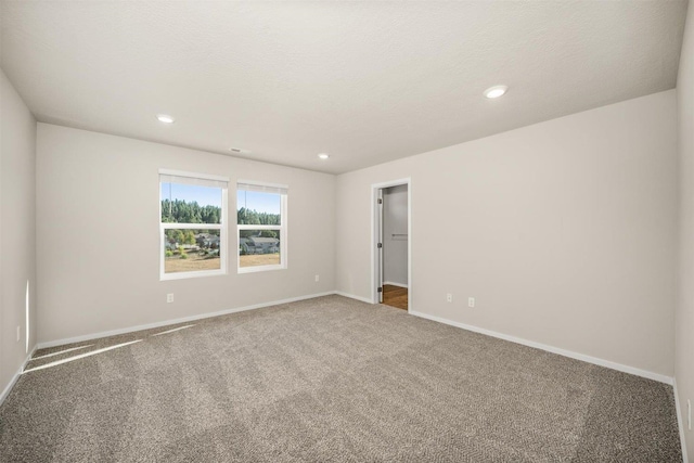 3285 N Mckinnon Rd, Spokane, WA 99217 - carpeted spare room with baseboards and recessed lighting