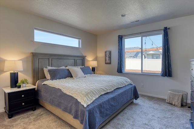 14621 E Sanson Ave, Spokane Valley, WA 99216 - bedroom featuring light carpet, a textured ceiling, and baseboards