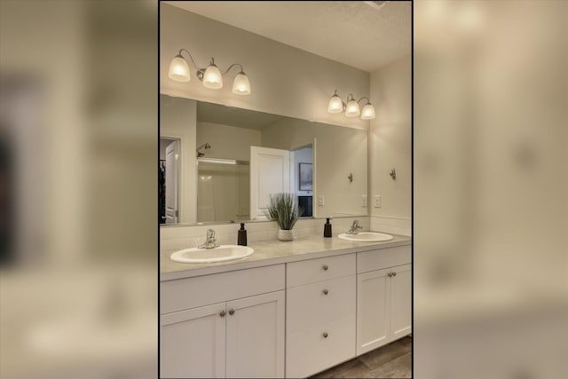 14621 E Sanson Ave, Spokane Valley, WA 99216 - full bathroom with a shower with door and double vanity