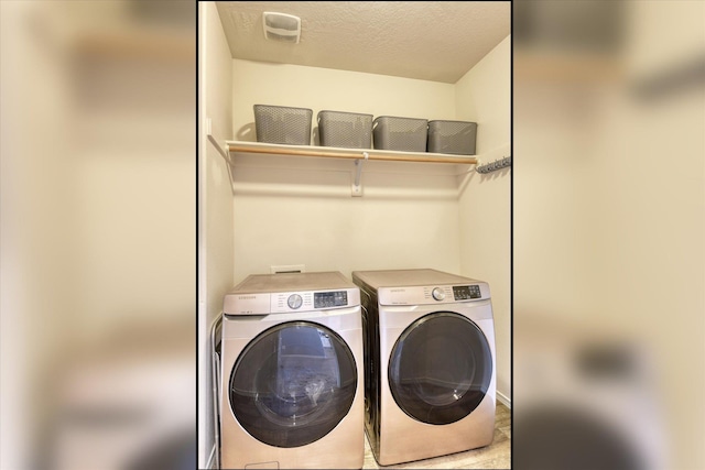 14621 E Sanson Ave, Spokane Valley, WA 99216 - washroom with separate washer and dryer and a textured ceiling