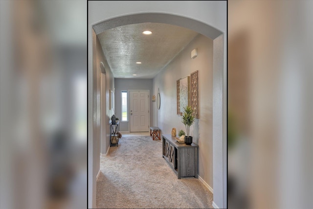 14621 E Sanson Ave, Spokane Valley, WA 99216 - corridor with arched walkways, carpet, a textured ceiling, recessed lighting, and baseboards