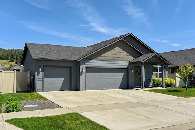 14621 E Sanson Ave, Spokane Valley, WA 99216 - ranch-style house with a garage, concrete driveway, fence, and roof with shingles
