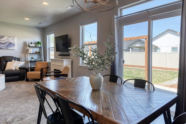 14621 E Sanson Ave, Spokane Valley, WA 99216 - dining space with a chandelier, recessed lighting, and a premium fireplace