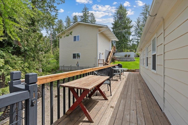 deck with fence and outdoor dining space