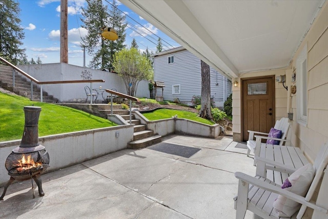 view of patio / terrace featuring a fire pit