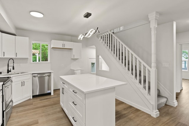 13704 E Heroy Ave, Spokane Valley, WA 99216 - kitchen featuring stainless steel appliances, a sink, light wood-style floors, and plenty of natural light