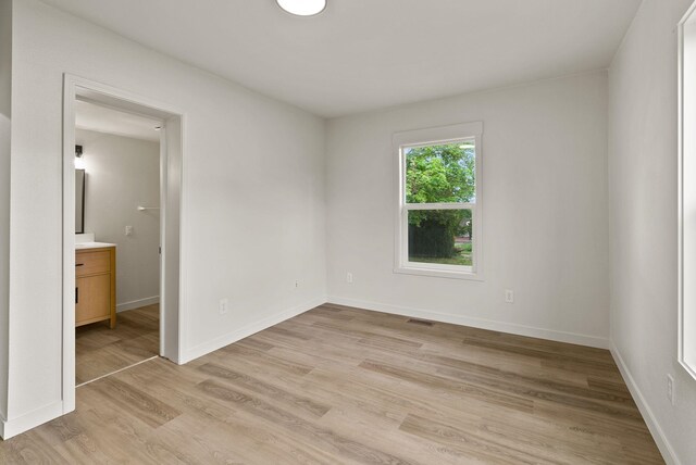 13704 E Heroy Ave, Spokane Valley, WA 99216 - empty room with light wood-type flooring and baseboards