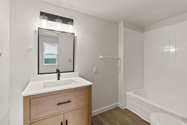 13704 E Heroy Ave, Spokane Valley, WA 99216 - full bath with wood finished floors, vanity, baseboards, and toilet