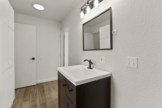13704 E Heroy Ave, Spokane Valley, WA 99216 - bathroom with wood finished floors and vanity
