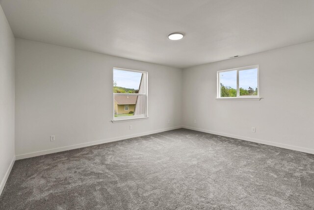 13704 E Heroy Ave, Spokane Valley, WA 99216 - carpeted spare room featuring healthy amount of natural light and baseboards