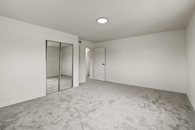13704 E Heroy Ave, Spokane Valley, WA 99216 - unfurnished bedroom featuring carpet floors, a closet, and baseboards