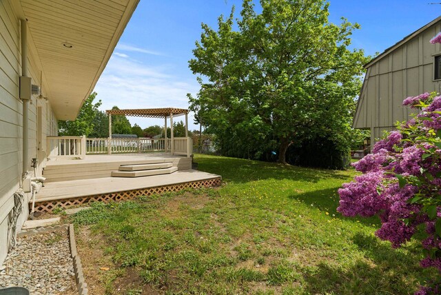 13704 E Heroy Ave, Spokane Valley, WA 99216 - view of grassy yard with a deck