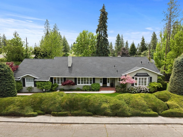 1202 E Christmas Tree Ln, Spokane, WA 99203 - ranch-style home featuring a chimney, a shingled roof, and a front lawn
