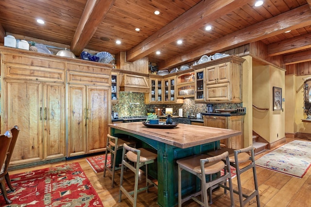 10351 N Gibson Rd, Hayden, ID 83835 - kitchen with wooden counters, beam ceiling, backsplash, light wood finished floors, and wood ceiling