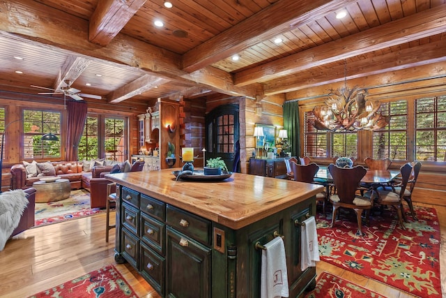 10351 N Gibson Rd, Hayden, ID 83835 - kitchen with wooden ceiling, wood counters, a chandelier, light wood-style flooring, and beam ceiling