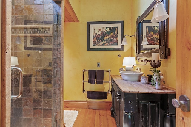 10351 N Gibson Rd, Hayden, ID 83835 - corridor featuring a sink, wood finished floors, and baseboards