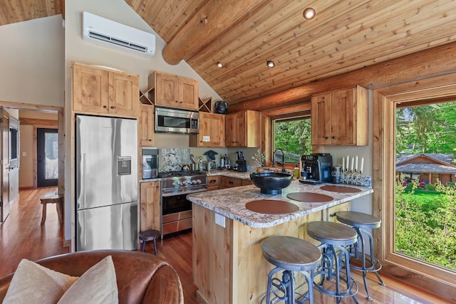 10351 N Gibson Rd, Hayden, ID 83835 - kitchen featuring stainless steel appliances, a wall unit AC, a peninsula, a sink, and wooden ceiling