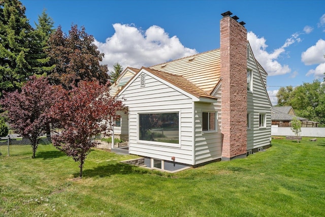11707 E Broadway Ave, Spokane, WA 99206 - rear view of property with a chimney
