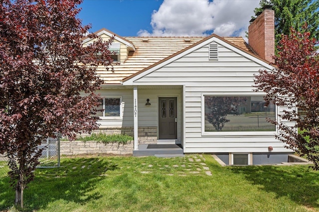 11707 E Broadway Ave, Spokane, WA 99206 - view of front of house featuring a front lawn and a chimney