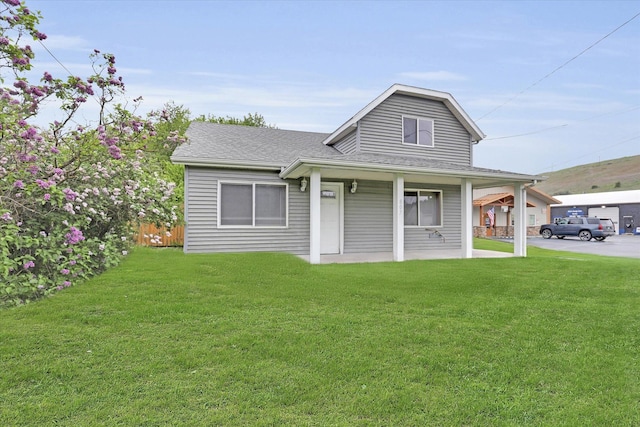 view of front of house with covered porch and roof with shingles