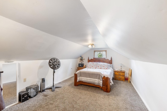 bedroom featuring carpet flooring, vaulted ceiling, and baseboards