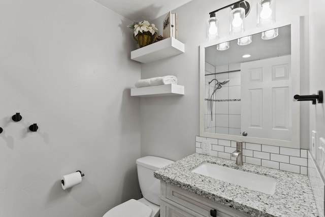 16814 N Tamarac Ln, Nine Mile Falls, WA 99026 - full bath featuring toilet, vanity, backsplash, and tiled shower